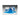 A container of bath bombs is spilled causing blue gel to flow onto a flat surface in a gray environment