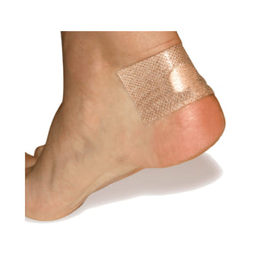 Adhesive knit strip from the Spenco 2nd skin blister kit placed on a heel